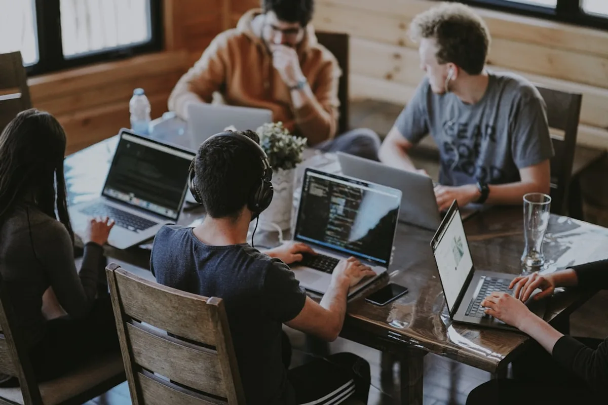 Business team using laptop computers in a professional technology environment