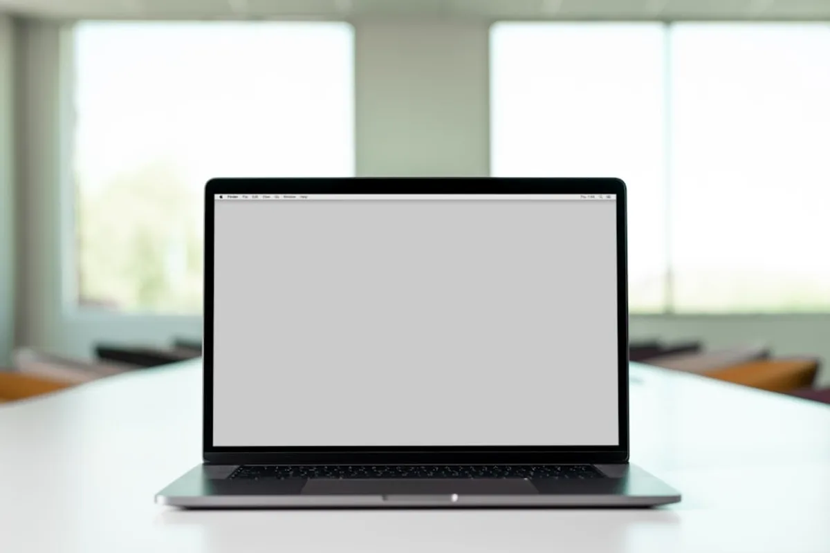 Business laptop on a clean desk in a professional office setting