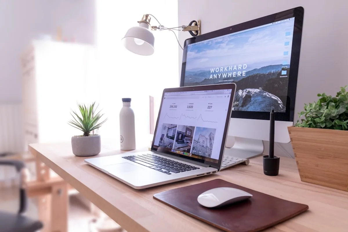 Professional office workstation setup with multiple computers and monitors
