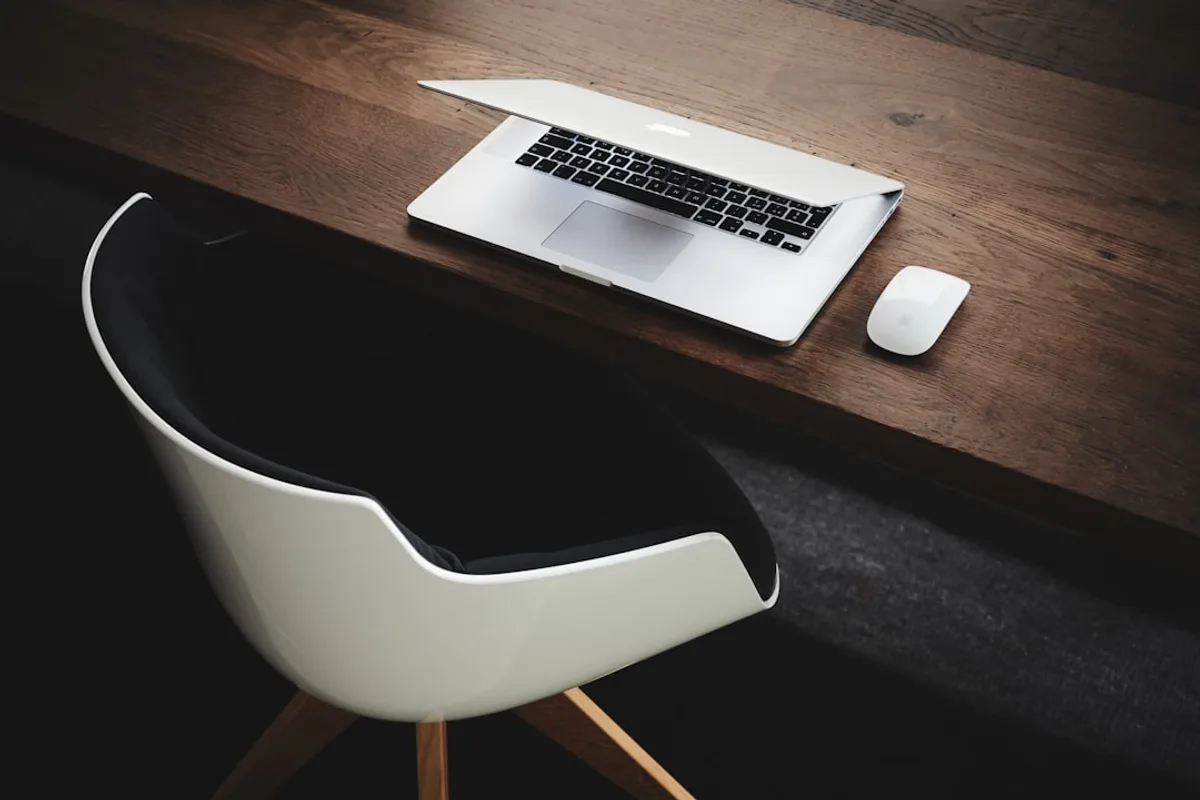 Clean professional desk workspace with computer and mouse